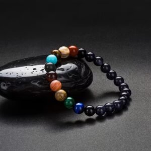 Pulsera de sistema solar con planetas y galaxias